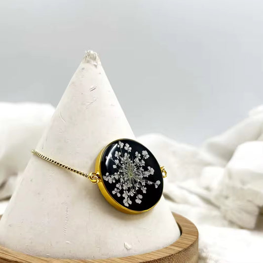 Gold-Tone Pressed Flower Resin Pendant Necklace (Black Oval)