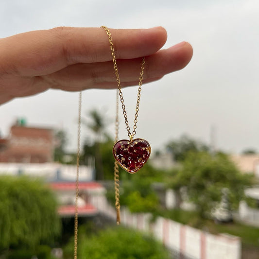 Heart-Shaped Resin Necklace with Red Floral Pendant